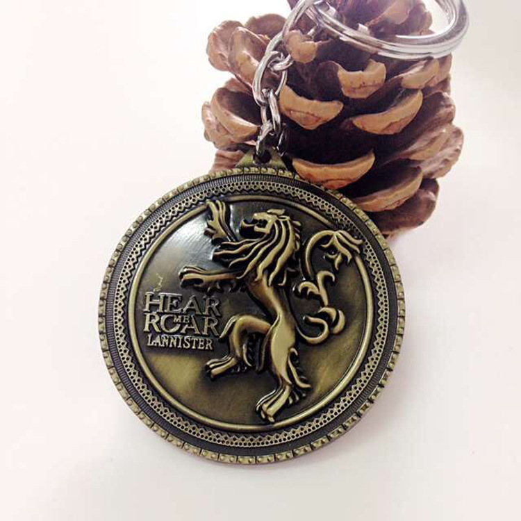 8(499)9387578 Купить брелок герб со львом дома ланнистеров в круге бронза из сериала "игра престолов" от  - заказать